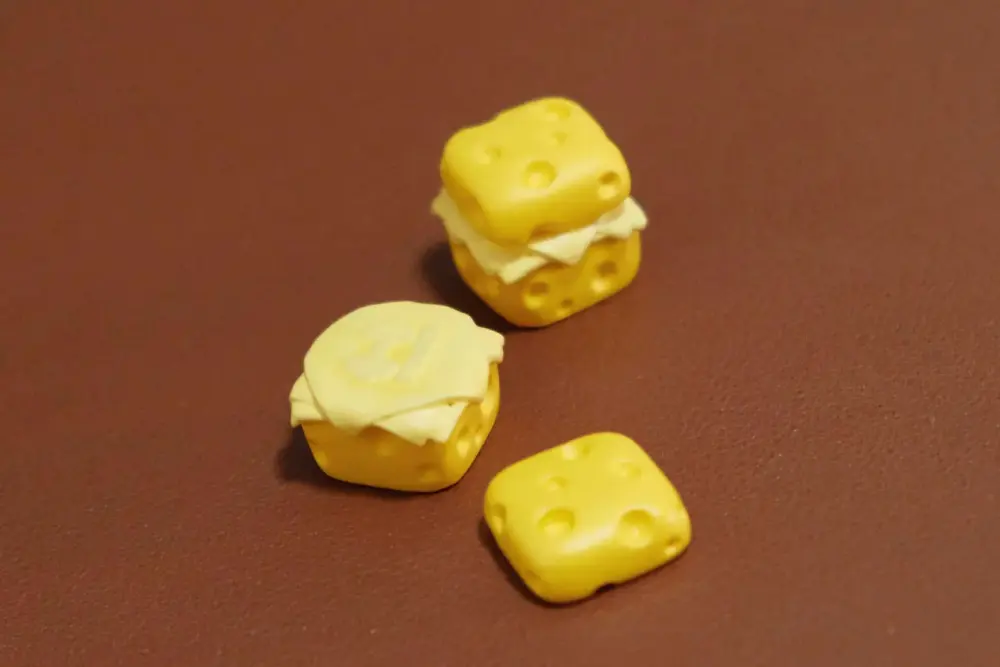 Cute Cheese Magnetic Keycap Disassembled Parts Disassembled 3D printed cheese artisan keycap showing magnetic base and top components.