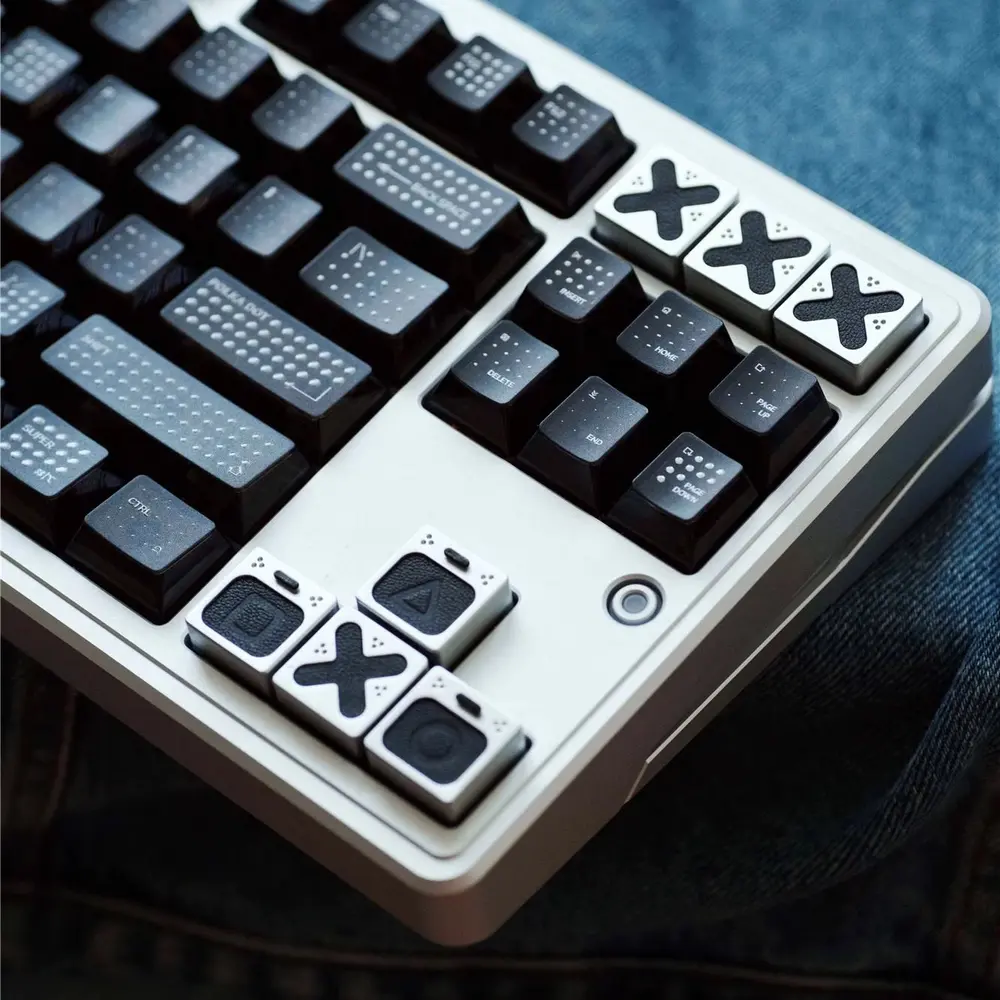Genuine Leather Gaming Symbol Keycaps Installed Angled shot of leather playstation keycaps installed on a white mechanical keyboard showing arrow and nav keys.