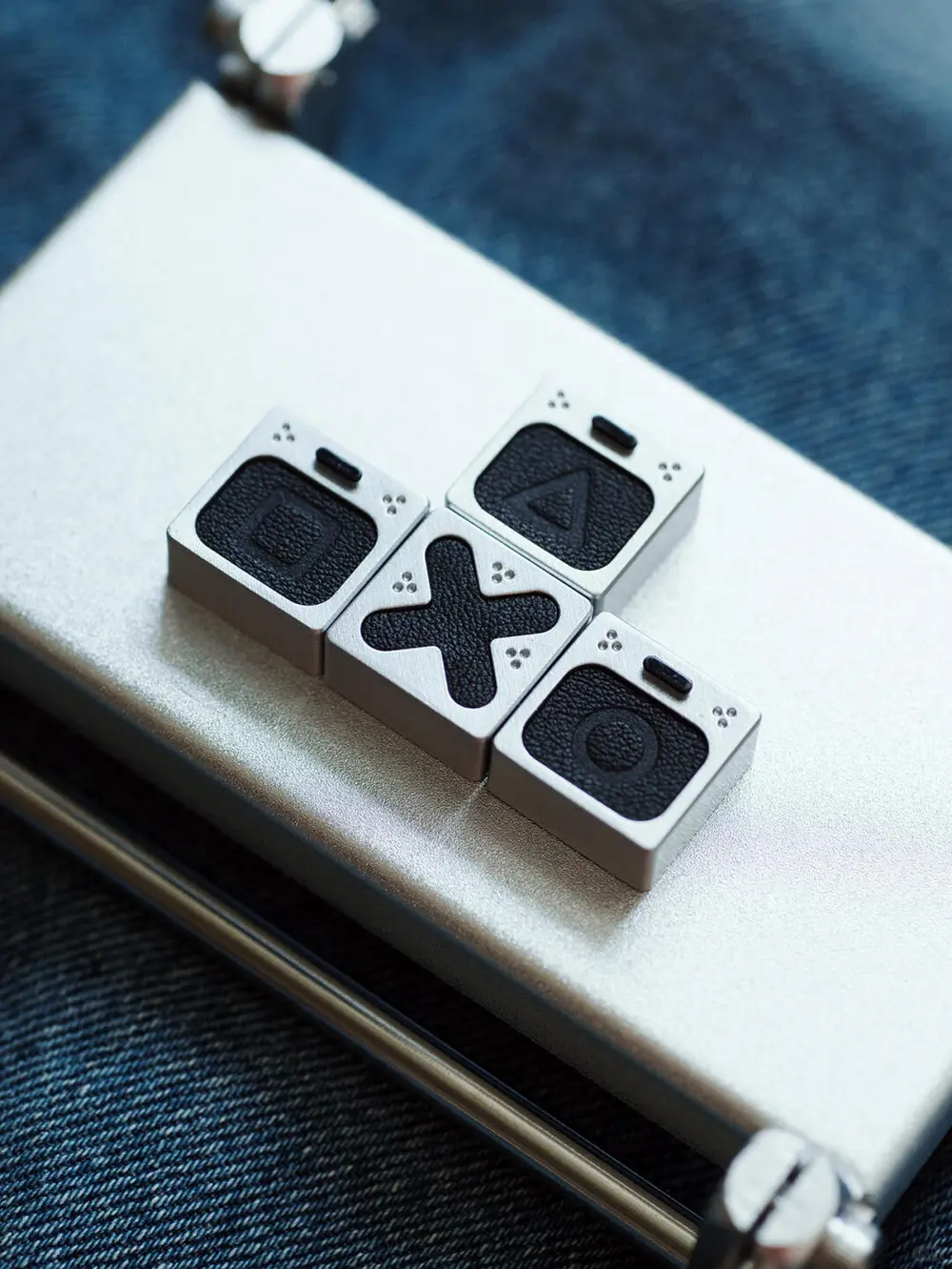 Leather PlayStation Symbols Keycaps Set Genuine leather PlayStation keycaps featuring square triangle cross and circle symbols.
