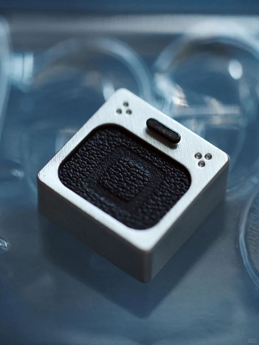 Silver Frame Leather Keycap with Square Symbol Genuine leather PlayStation keycap featuring a square symbol on a metallic resin base.