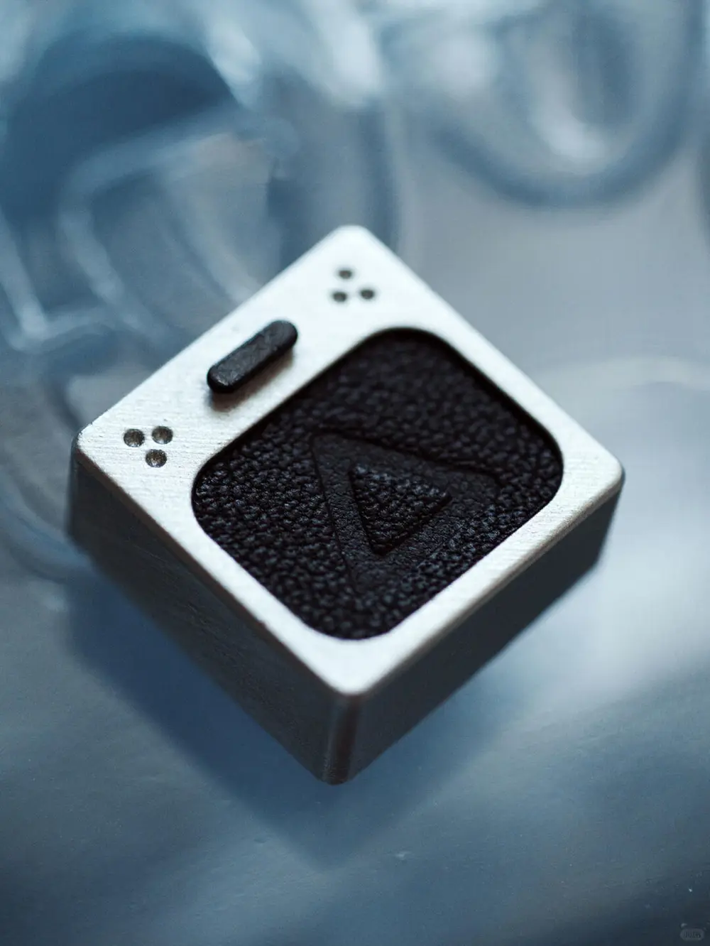 Genuine Leather PlayStation Triangle Keycap Artisan keycap with metallic finish and black leather insert showing a hot-stamped triangle gaming symbol.