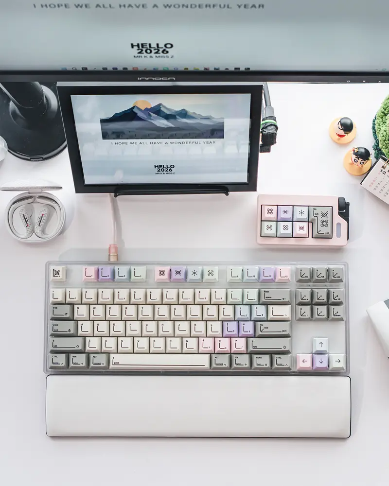 Desktop arrangement showing SINOKEY Pastel Keycaps with soft gradients and line art legends.