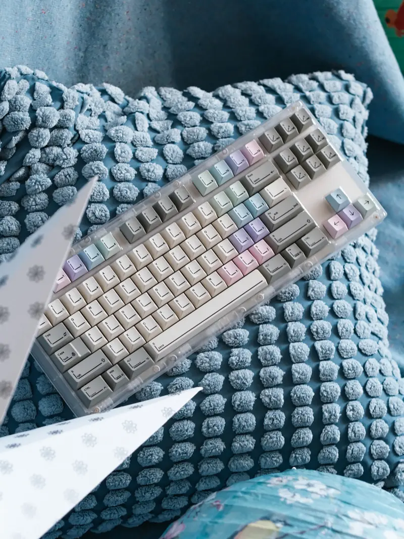 Top view of SINOKEY Pastel Retro Design Cherry Profile Keycaps installed on a keyboard with soft pink and blue accents.