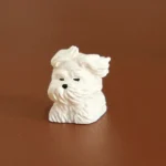 Front view of the white Cute Wind-Blown Puppy Keycap showing wind-swept fur details.