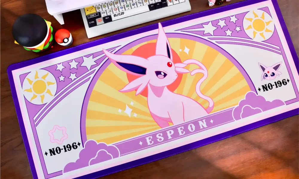 Pokemon Espeon large gaming desk mat with No 196 text and sun patterns next to a keyboard.