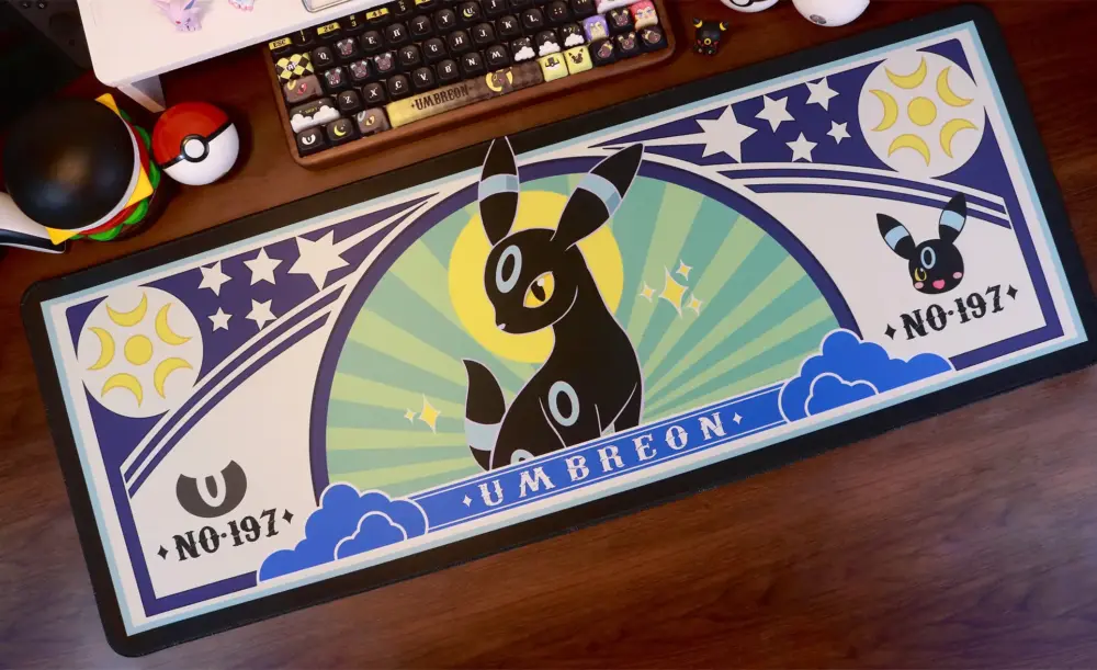 Top view of Umbreon large gaming desk mat with moon and star graphics and No 197 text.