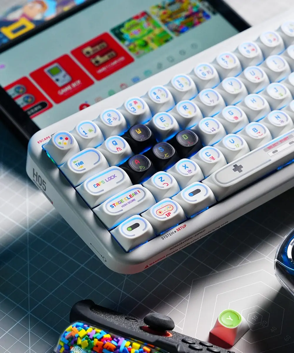 Game Console Theme Backlit MDA Profile Keycaps Close Up High-angle view of MDA profile keycaps with distinct PBT and PC composite materials for backlighting.
