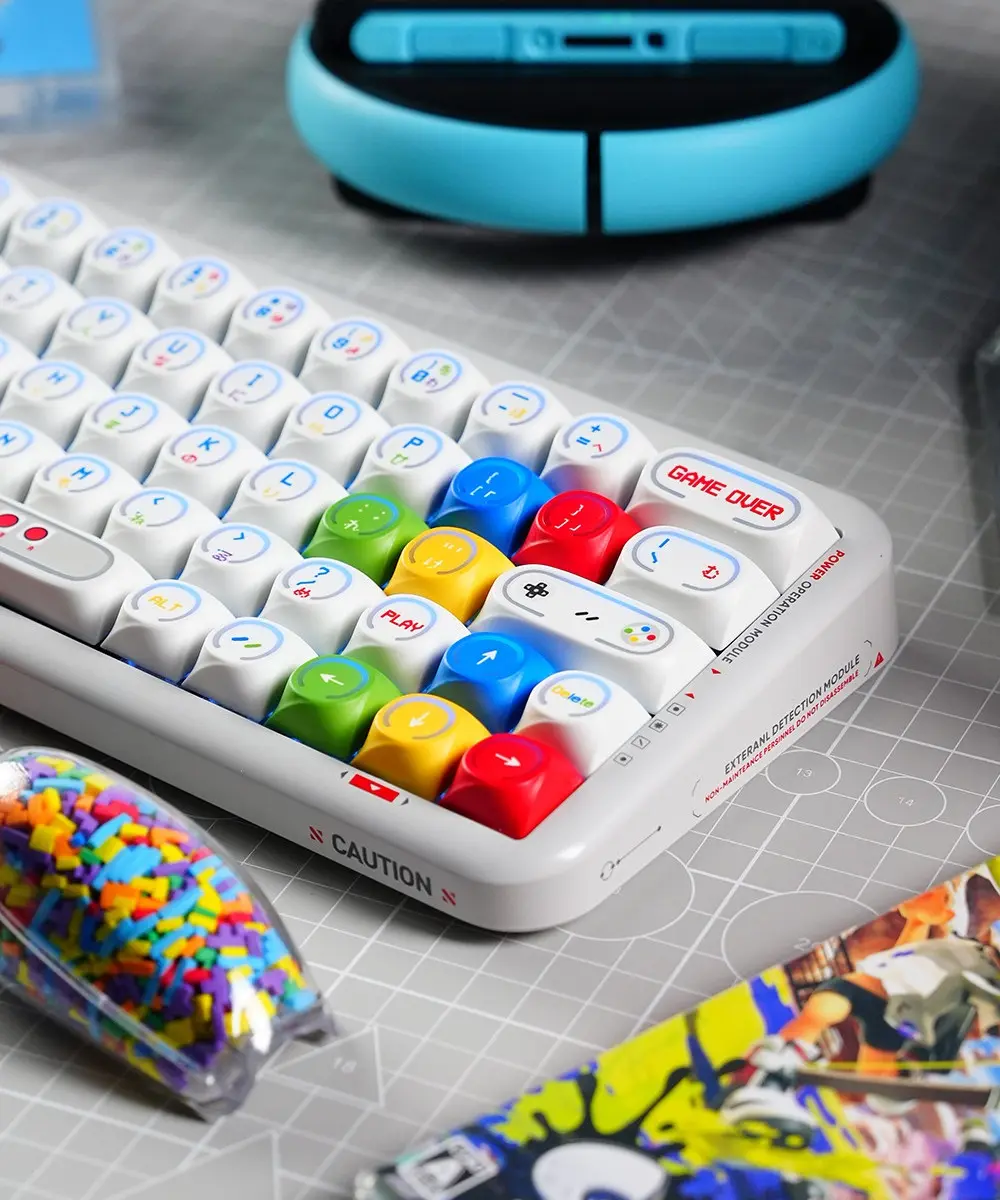 Game Console Theme Backlit MDA Profile Keycaps Close Up Angled view of MDA profile keycaps with Game Over and Play legends in retro colors.