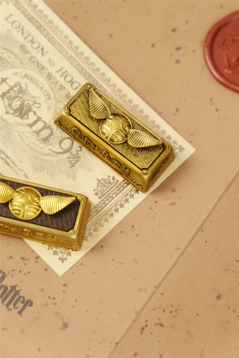 Vintage style Golden Snitch artisan keycap for a 2.25U Enter key on a themed background.
