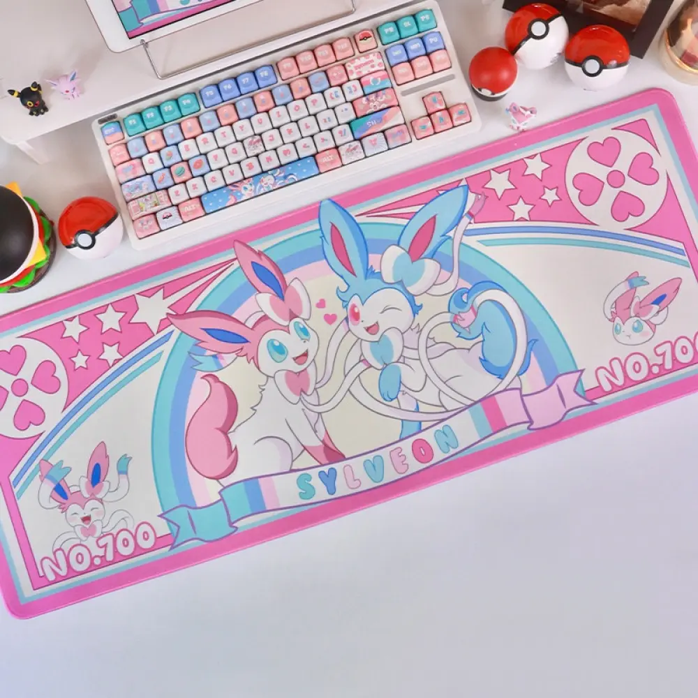 Pokemon Sylveon large gaming desk mat with pink and blue pastel designs styled with a keyboard and Poke balls.
