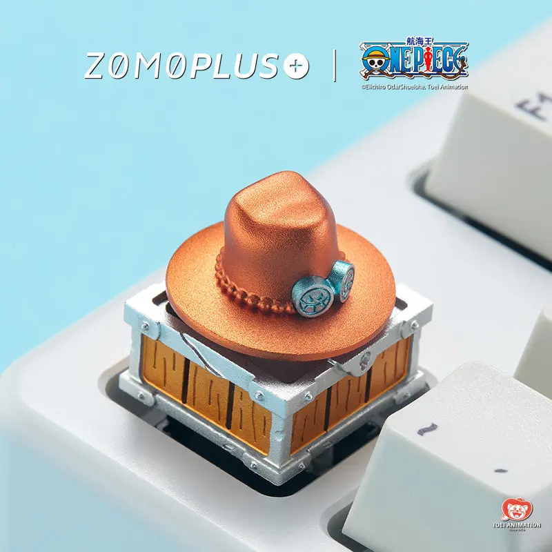 ZOMOPLUS One Piece Ace’s Hat Rotating Aluminum Artisan Keycap Close-up of the ZOMOPLUS One Piece Ace's rotating hat aluminum artisan keycap on a keyboard.