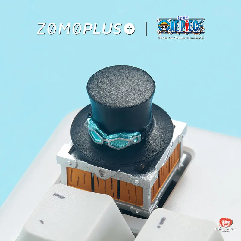 Aluminum artisan keycap depicting Sabo's hat from One Piece on a treasure chest base.