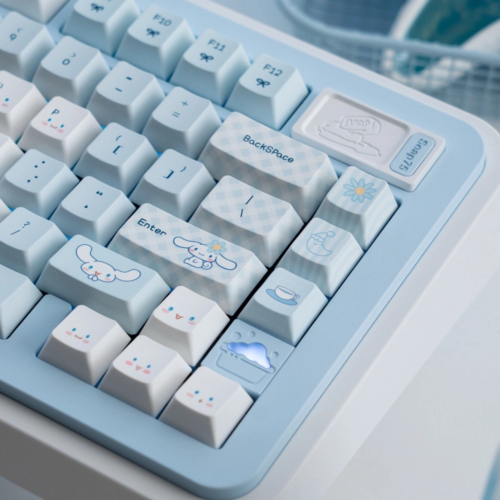 Close up of Cinnamoroll character novelty keycaps with paw prints and cloud motifs from the Cherry Profile PBT set