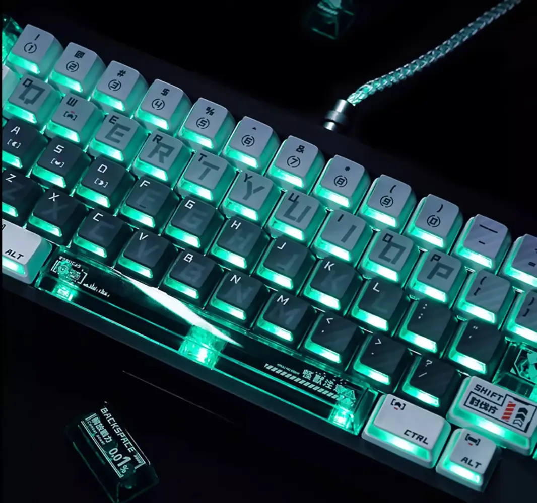 Kaiju No. 8 merchandise keycaps glowing green on a keyboard, featuring frosted PBT and clear PC edges.