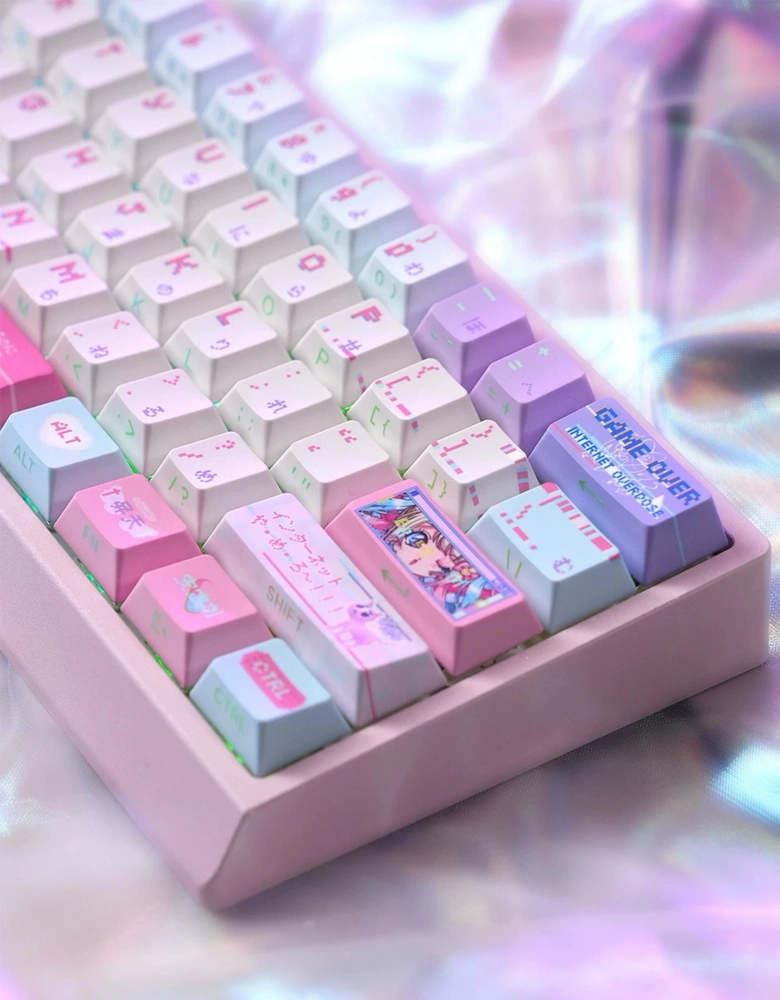 Front-facing view of KAngel themed pink PBT Cherry profile keycaps installed on a white mechanical keyboard with holographic desk mat