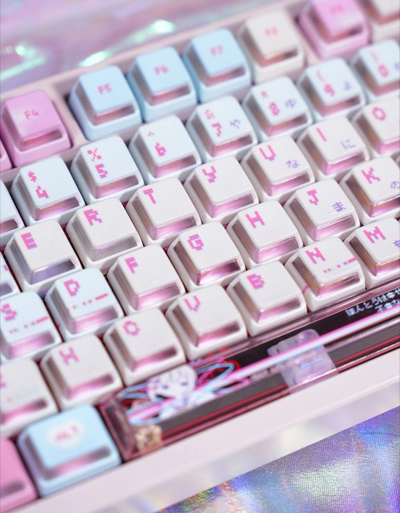 Close-up of Nuclear Power profile F-row and modifier keys showing translucent side walls, pink and blue color scheme, and spacebar artwork