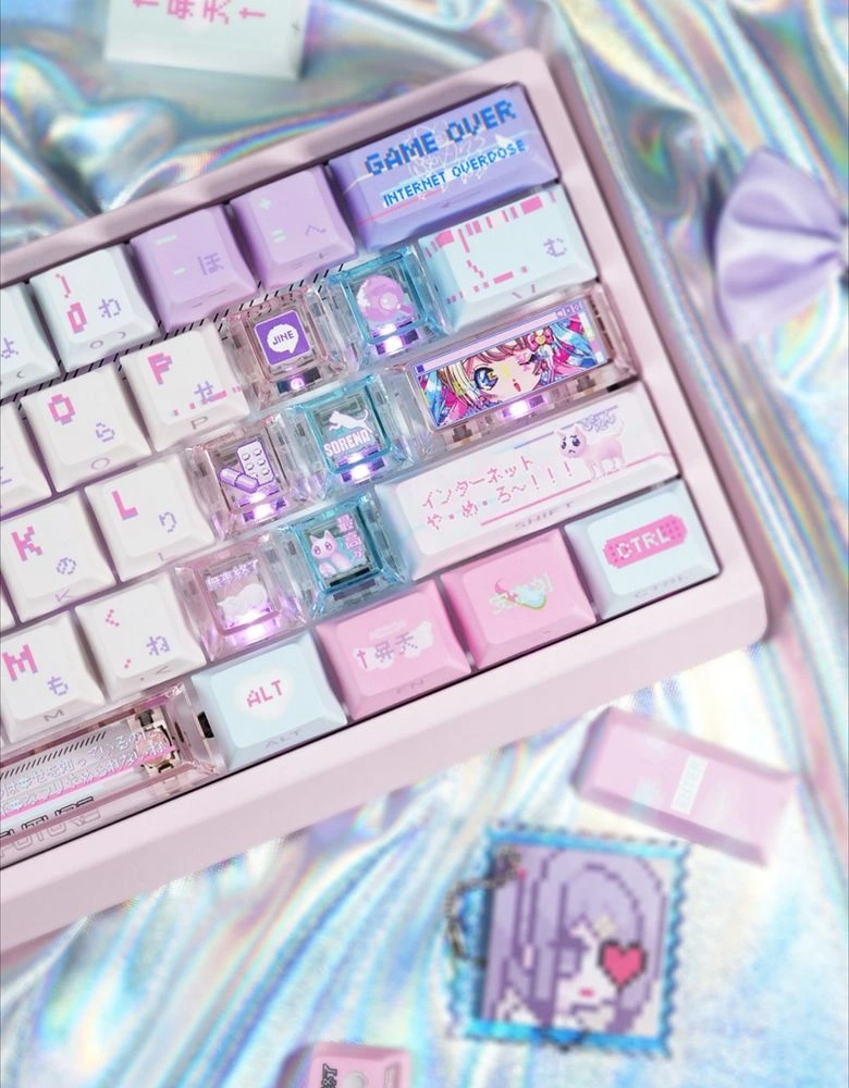 Close-up of pure PC translucent extension keycaps with KAngel artwork installed on pink keyboard showing full RGB light transmission