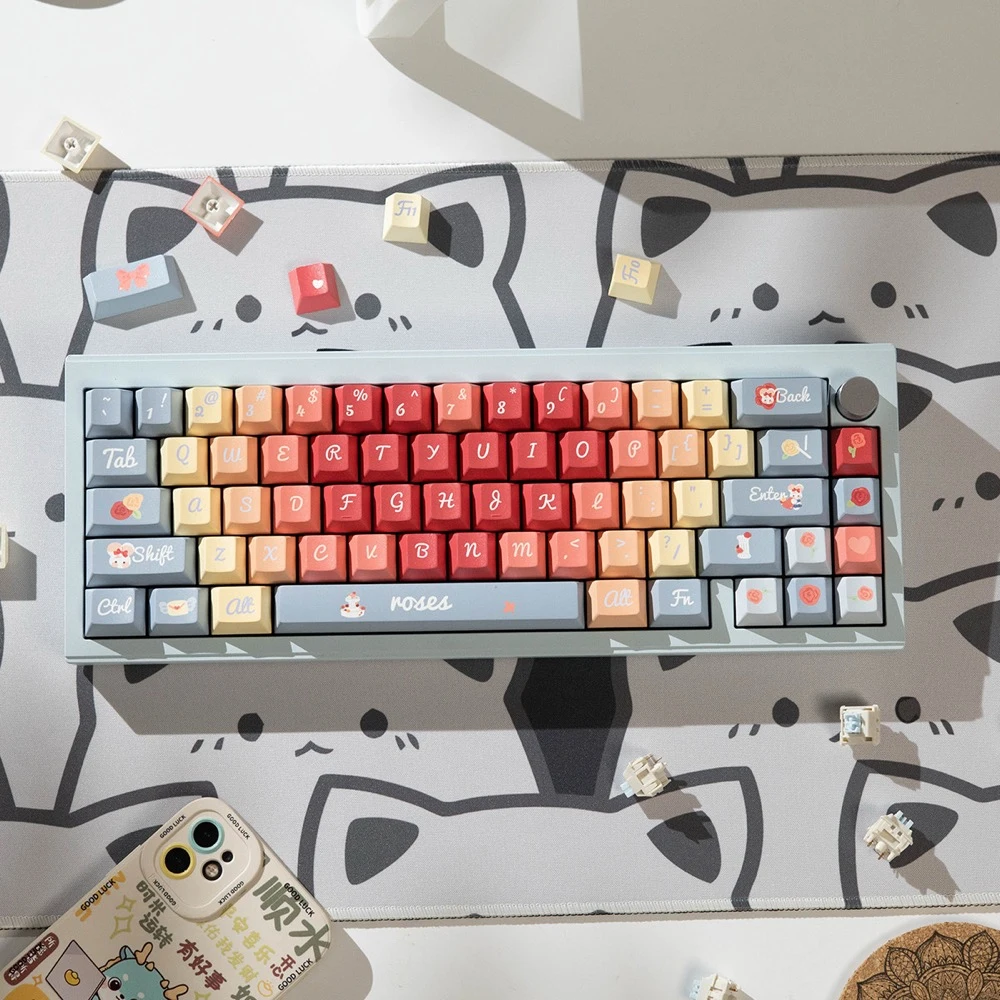 Roses Poem PBT keycaps on white desk with cat design mousepad overhead view showing full keyboard layout