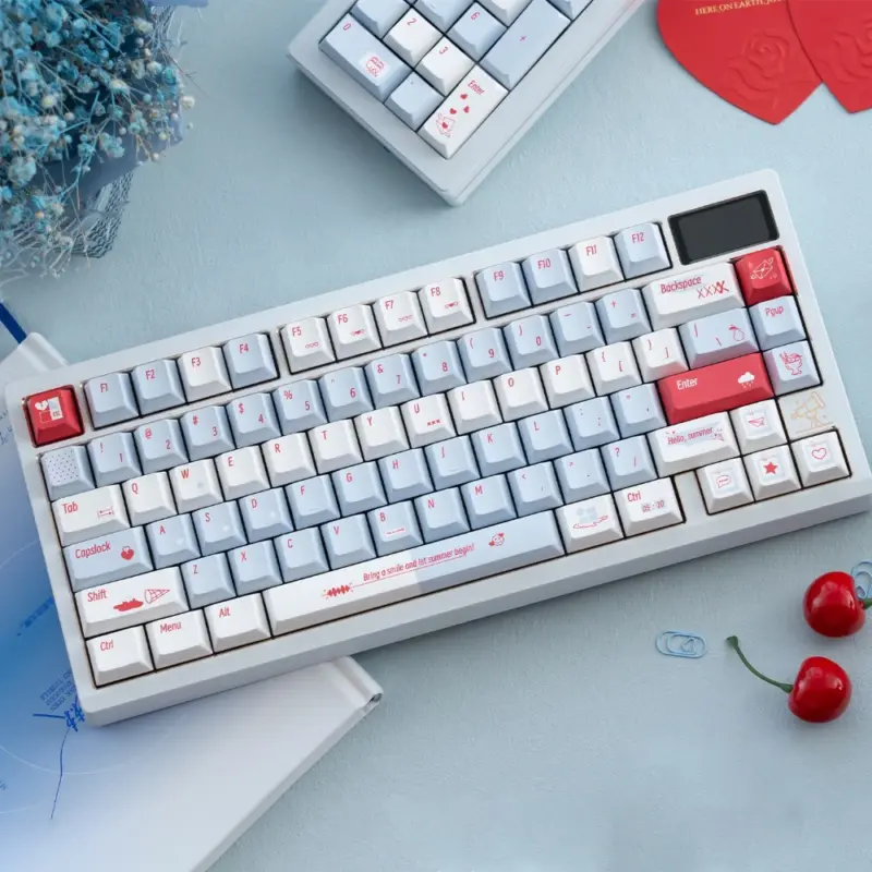 Summer blue PBT Cherry Profile keycaps on a white mechanical keyboard showing gradient alphas and coral novelties