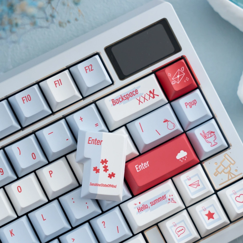 Close up of summer-themed novelty keycaps with SunshineStateOfMind and Hello Summer legends in coral and gold