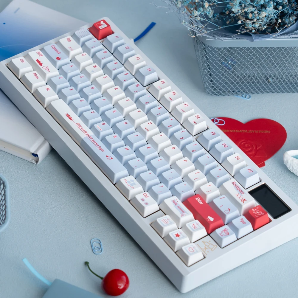 Close up of Summer Blue PBT keycaps on a white keyboard showing dye-sublimated legends and matte texture