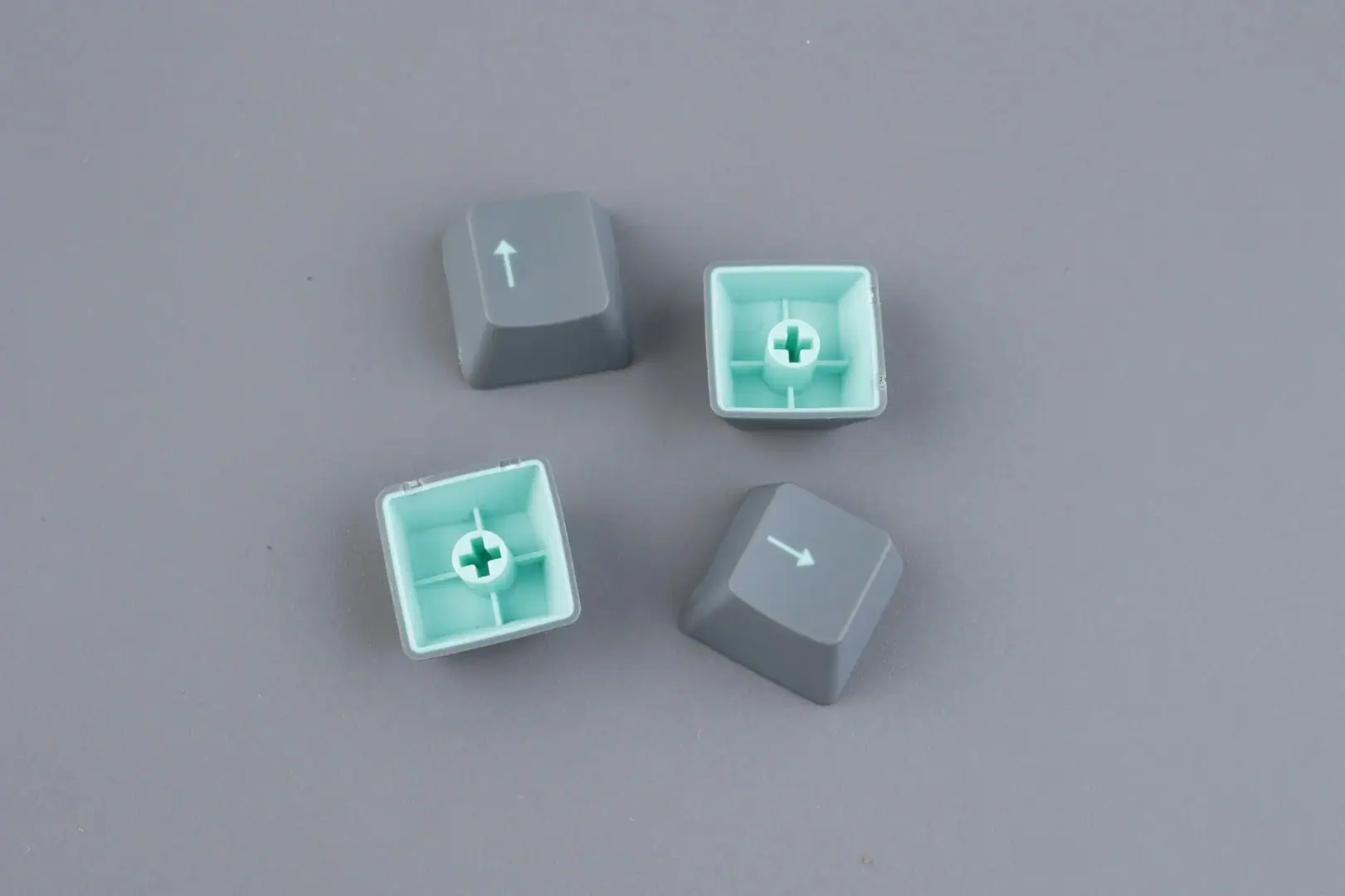 Close-up macro shot of a doubleshot PBT keycap showing crisp legend edges where two different colored plastics meet