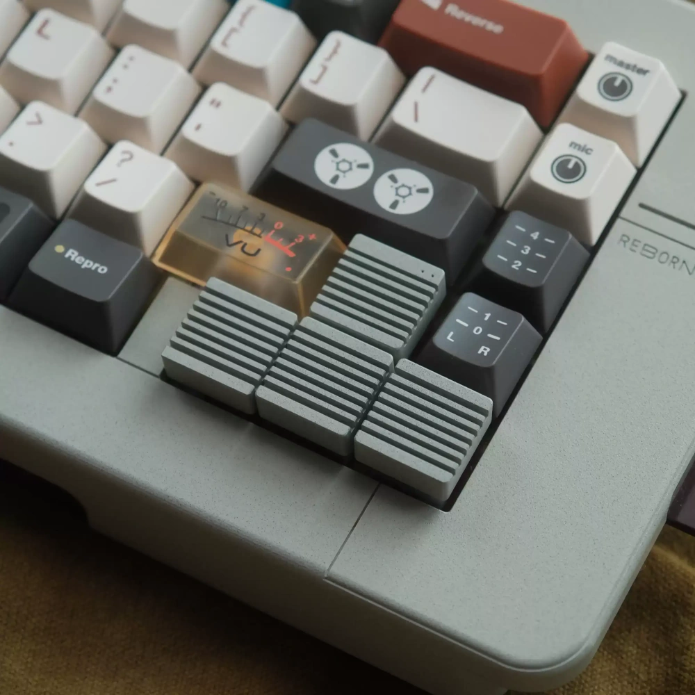 Linen Grey Heatsink Arrow Keycaps Linen grey CNC aluminum heatsink metal artisan keycaps replacing arrow keys on a custom mechanical keyboard.