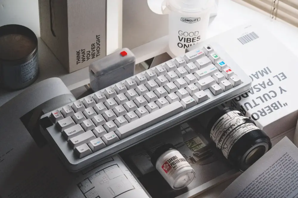 Retro Mac Keycaps Desk Setup Close-up view of retro Mac specific cherry profile keycaps with vintage icons on a desk.