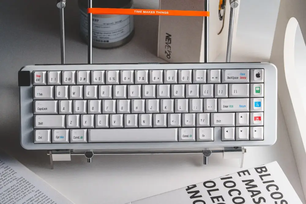Retro Mac Keycaps on Compact Keyboard Layout Close-up view of white Cherry profile Mac keycaps with vintage Apple logo and floppy disk modifiers installed on a 60% keyboard.