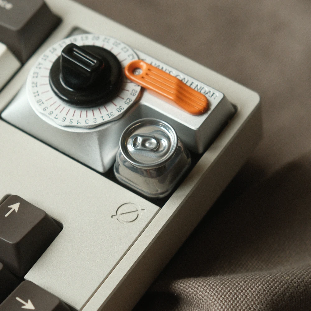 Miniature aluminum soda can custom keycap in reflective silver finish installed at the ESC position of a keyboard.