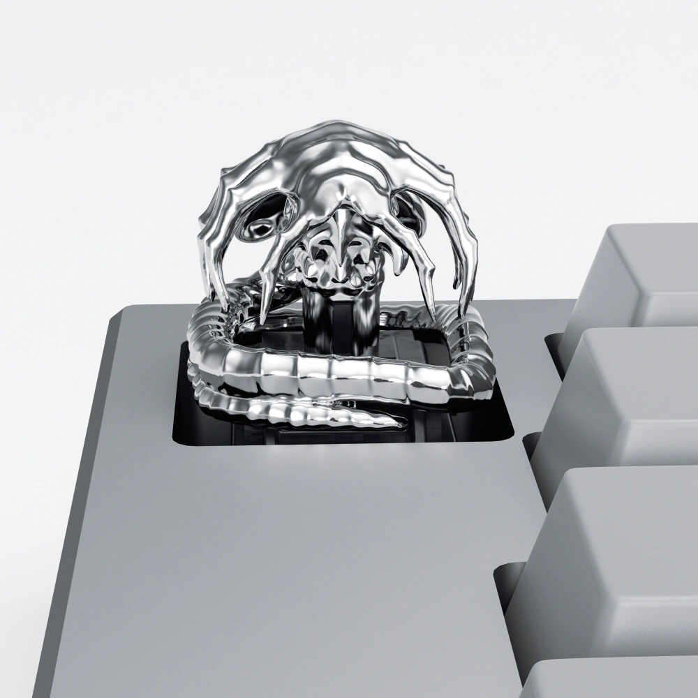 Polar Silver Alien Facehugger Keycap Polar silver alien facehugger artisan keycap on a grey mechanical keyboard.