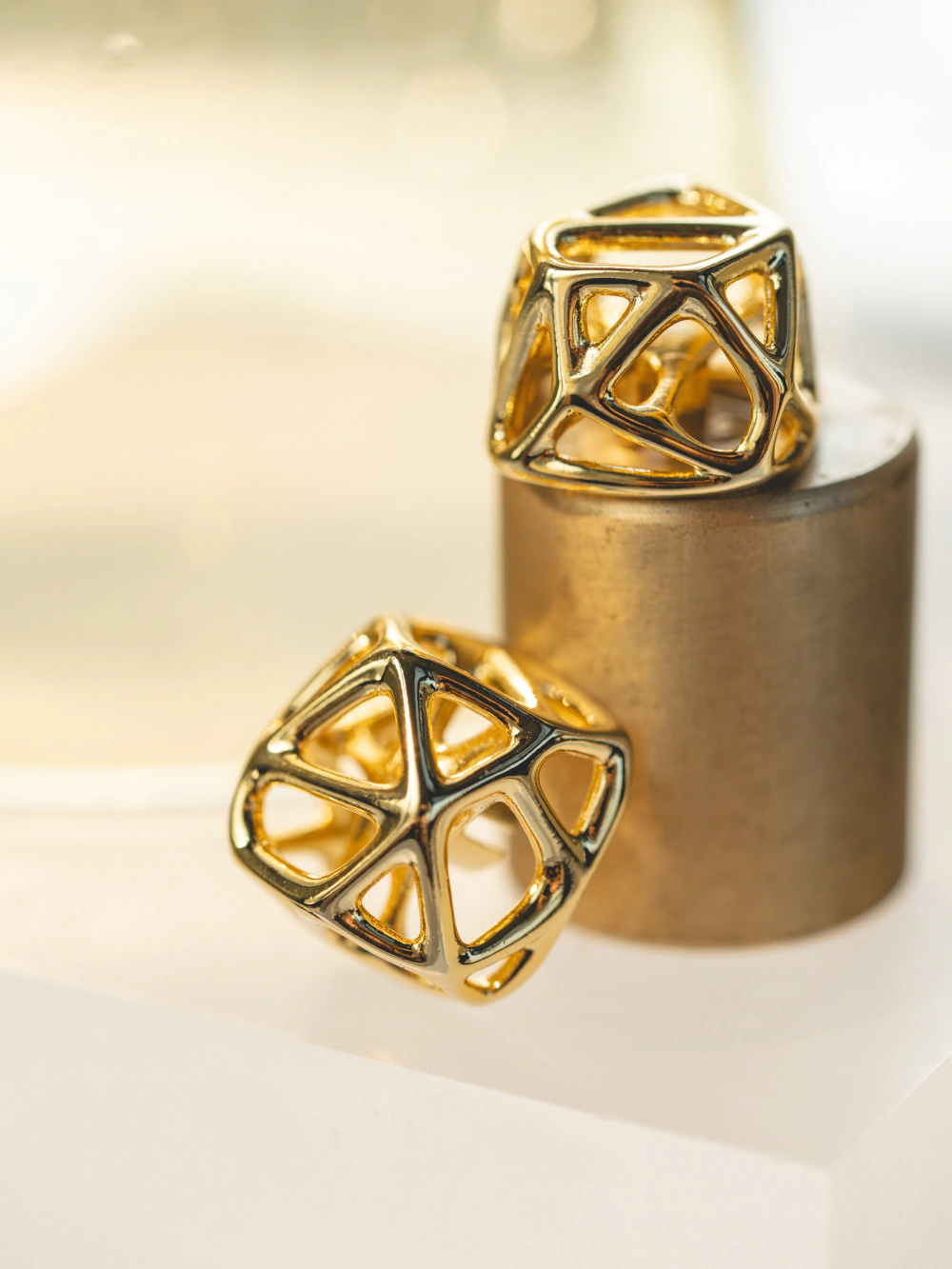Gold Futuristic Hollow Metal Keycap Gold futuristic handcrafted hollow metal artisan keycaps showcasing an organic lattice design on a display stand.