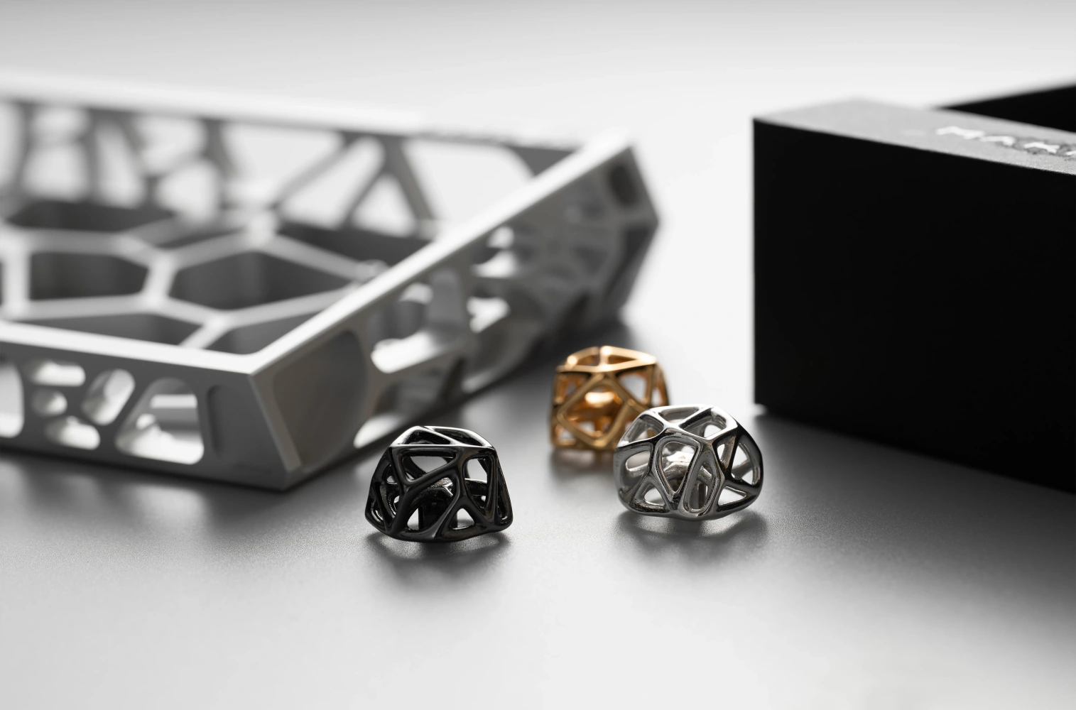 Hollow Metal Artisan Keycaps Futuristic hollow metal artisan keycaps in three finishes featuring an organic cell lattice design.
