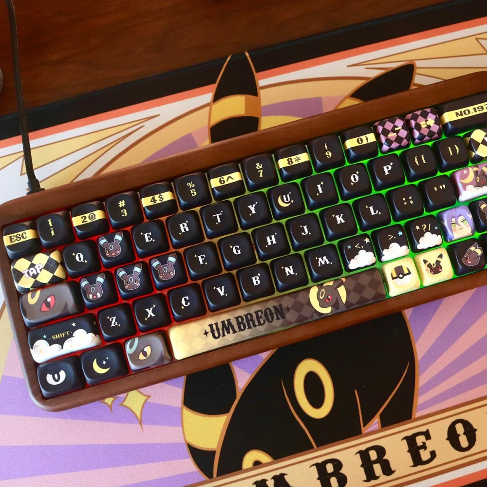 Rounded Moonlit Companion keycaps featuring Umbreon art and gold accents on wood.