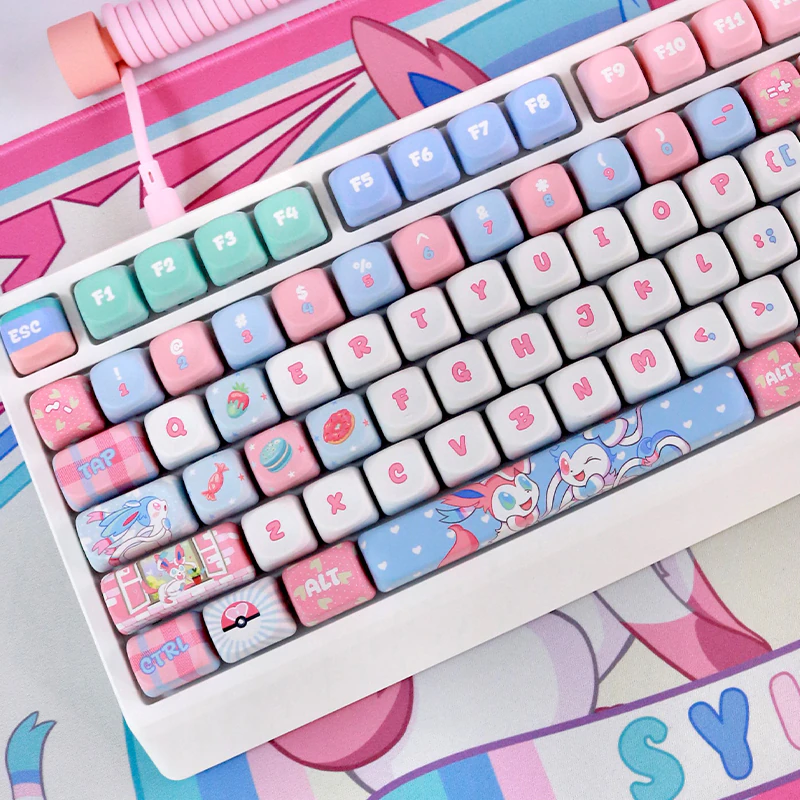 Keyboard fitted with Pastel Dream Companion MOA keycaps showing rounded tops and colorful accent keys.