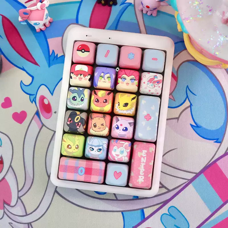 Compact white macropad featuring pastel MOA profile keycaps with cute designs.