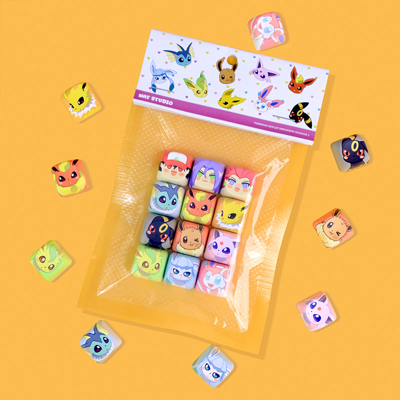 Clear plastic package of NAT Studio Pokemon Eeveelution keycaps featuring Eevee, Jolteon, Flareon and other evolutions.