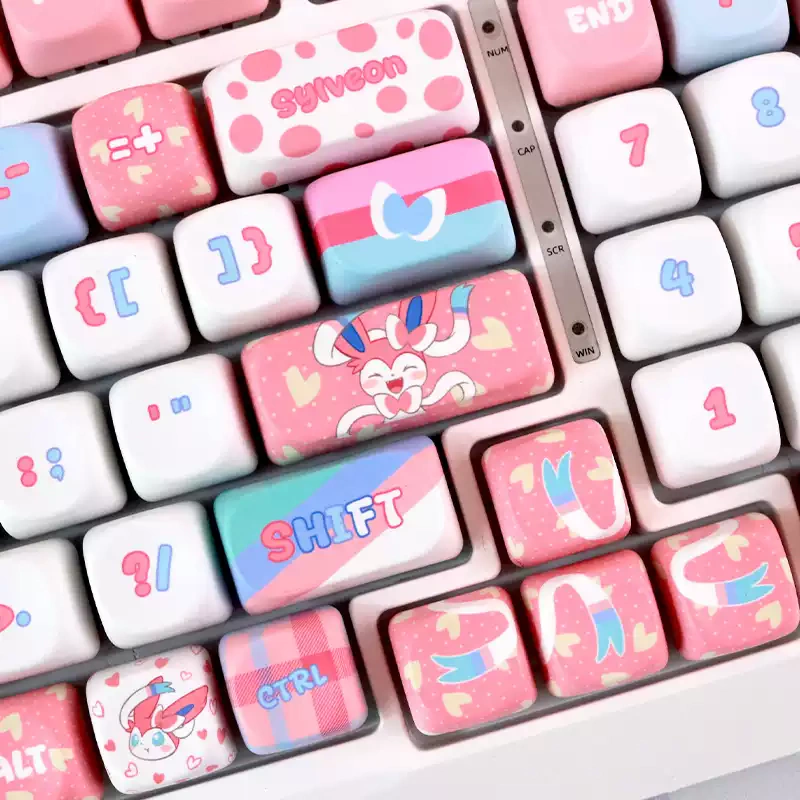 Rounded pastel MOA profile keycaps featuring Sylveon artwork and ribbon accents.