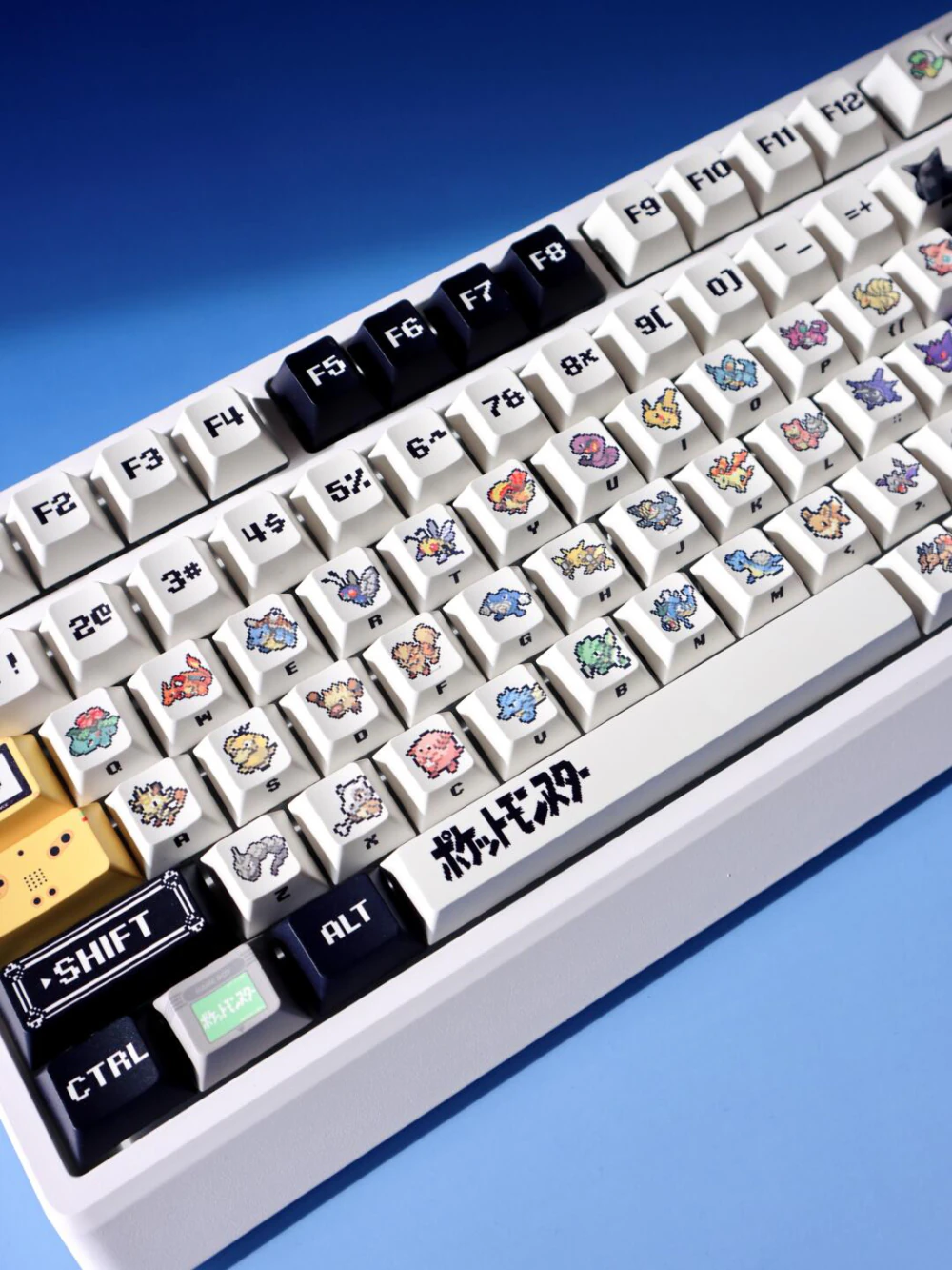 Retro red and green pixel keycaps with Cherry profile on a white keyboard.