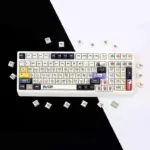 Retro red and green pixel Cherry profile keycaps arranged in a white keyboard layout.