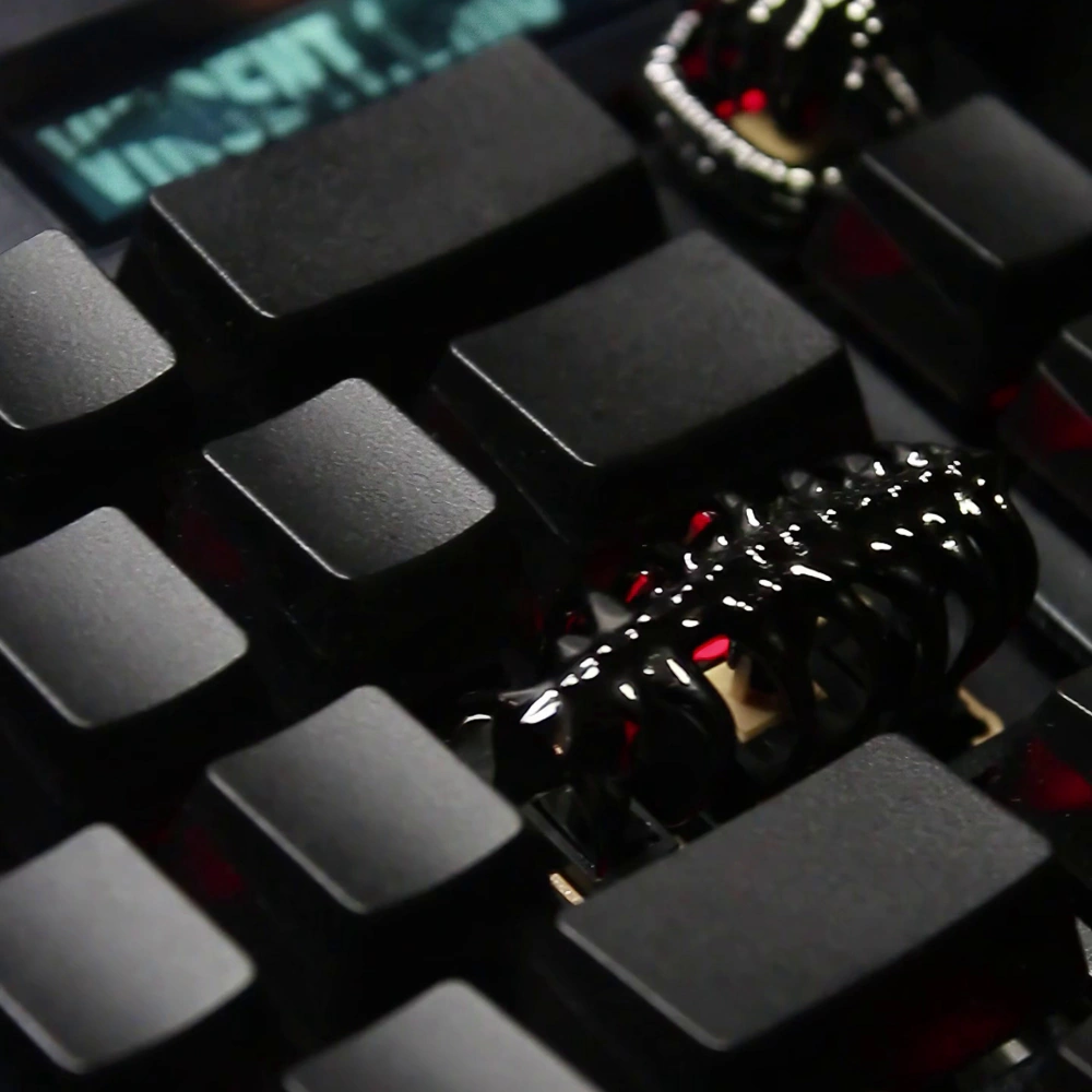 Sci-Fi Creature Keycap on Black Keyboard Handmade copper keycap featuring sculpted sci-fi creature design on a black keyboard.