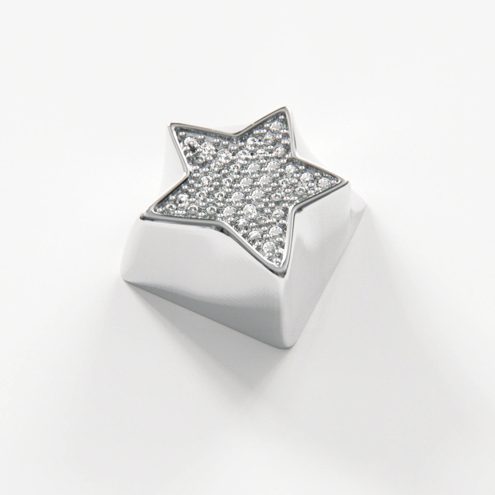 Sparkling star keycap with a platinum finish and cubic zirconia stones catching the light on a white background.