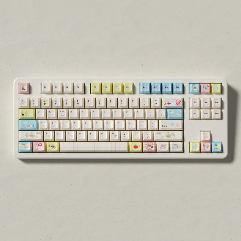 Front view of a compact white keyboard fitted with Cozy Journal keycaps.