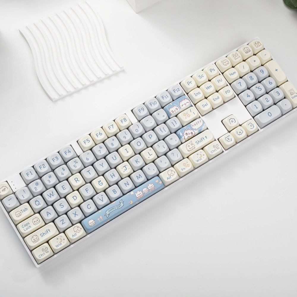 Full-size keyboard covered with blue cream and gray cat themed keycaps
