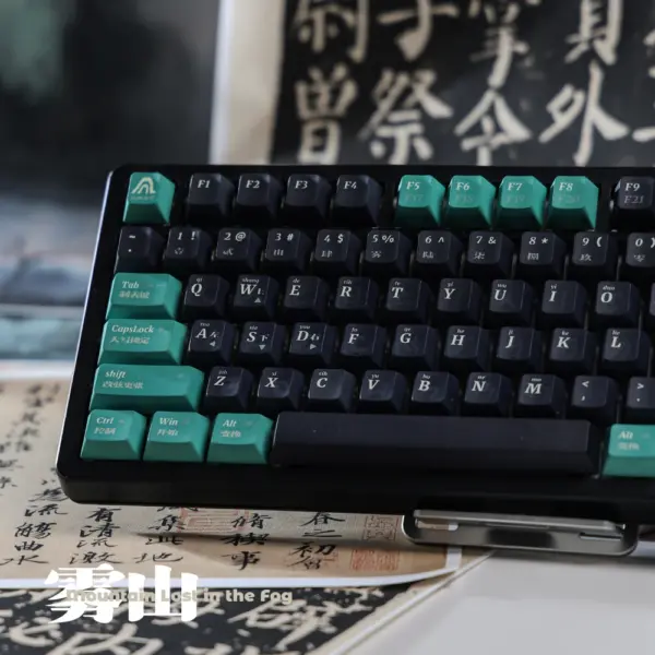 Front-left view of dark keycaps and sea-green modifiers on a black keyboard.