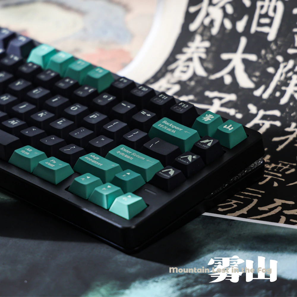 Low-angle view of sea-green modifier keys and dark keys on a black keyboard.