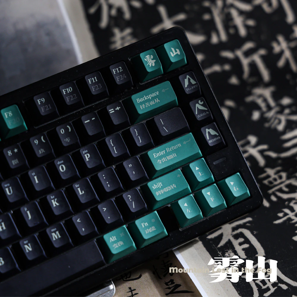 Angled close-up of green Enter and Backspace keys beside dark keyboard keys.