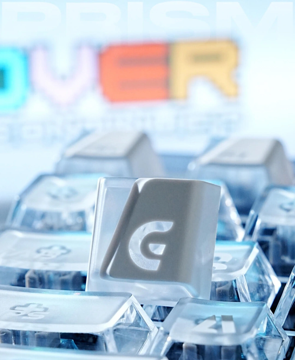 Shine-Through Keycaps in 2026: Classic and Modern Designs White Prism shine-through keycap with a large G legend standing among translucent keys