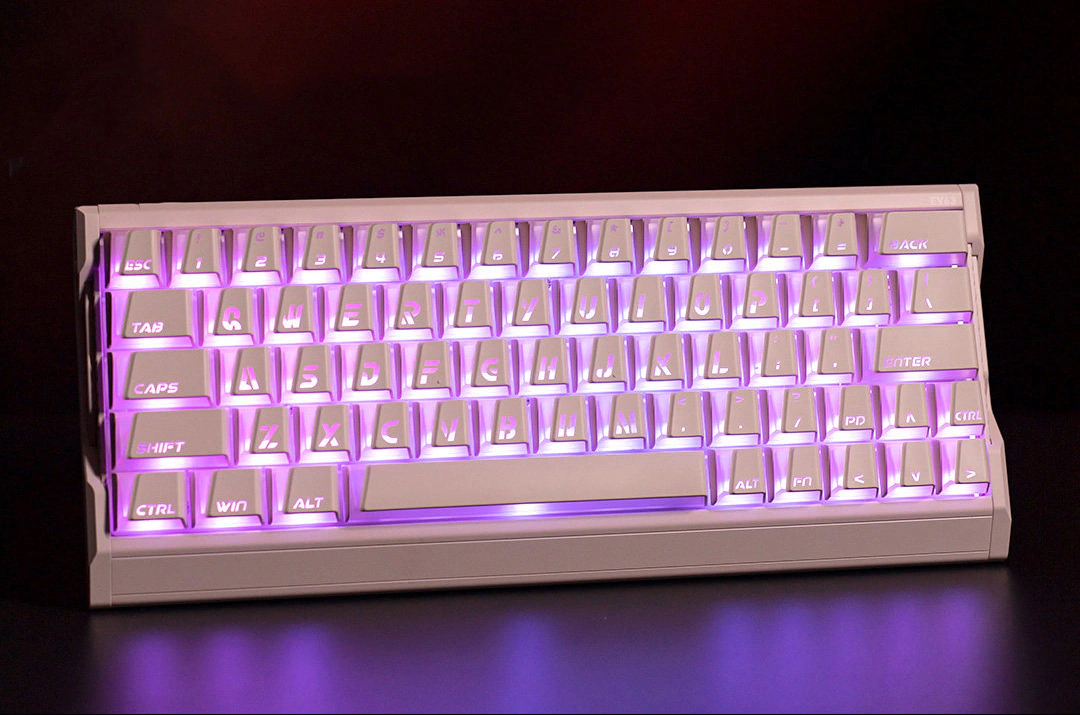 Shine-Through Keycaps in 2026: Classic and Modern Designs Pink Prism keycaps across a keyboard with purple RGB backlight