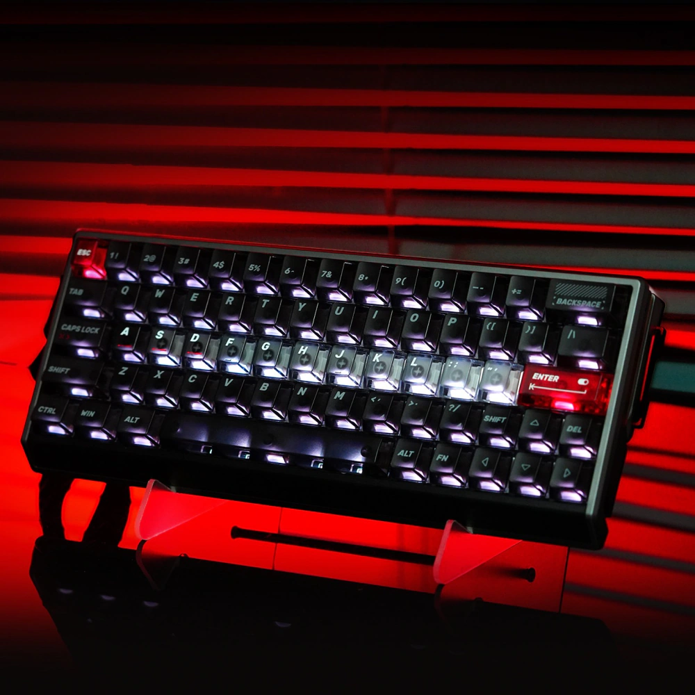 Angled compact keyboard with dark keycaps and a brighter translucent home row